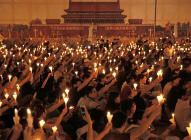 Participants hold candles at Tiananmen Square protest vigil, June 2016 in Hong Kong
